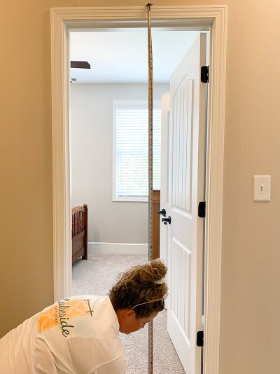 Measure the height of the doorway from trim to floor.